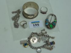 Hallmarked silver napking ring, charm bracelet, chain necklace, two rings and an Art Nouveau style