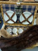 Two vintage fur collars and a picnic hamper