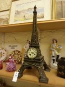 Late 19th century bronze 'Eiffel Tower' clock, striking movement on bell, 66cm