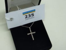 Platinum and diamond cross on chain stamped 720
