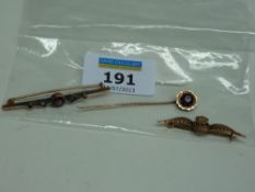 RAF tie pin stamped 9ct, a ruby bar brooch and stick pin