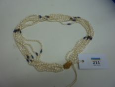 Six strand pearl necklace