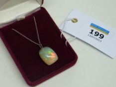Fine opal pebble pendant on chain stamped 750