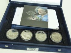 Four Queen Mother silver commemorative coins in collector's case with paperwork