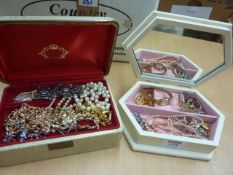Lockets, beads, brooches and watches in two jewellery boxes