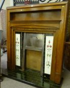 Art Deco oak framed fireplace, green tiled cast iron inset with tiled hearth, 131cm