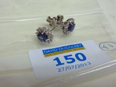 Pair of sapphire (approx 2.29 carat) and diamond cluster white gold ear-rings hallmarked 18ct