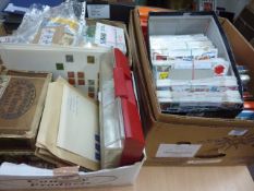 Large quantity of loose stamps, old catalogues, etc in four boxes