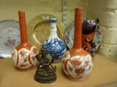 Three Japanese vases, blue and white Chinese bottle vase and a bronzed deity