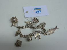 Hallmarked silver link bracelet with charms