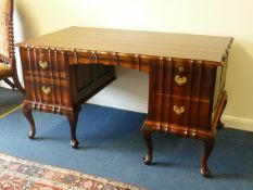 Reproduction Georgian style twin pedestal stinkwood desk, fitted with four drawers, 140cm