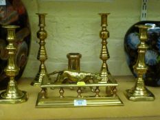 Two pairs of Victorian brass candlesticks, miniature fender and two other pieces of brassware