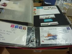 First day covers in two albums and a box