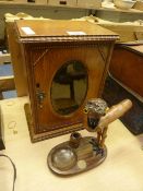 Edwardian smoker's oak cabinet with oval bevelled glass door and a novelty ashtray