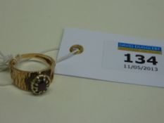 Garnet ring on gold bark shank hallmarked 9ct