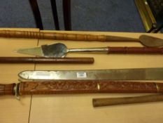 Collection of swords, pike staffs and reproduction medieval weapons