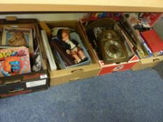 Old magazines, clocks, costume dolls, games etc in four boxes