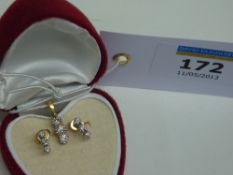 Three stone diamond earrings and matching pendant hallmarked 18ct