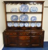 George III Yorkshire oak dresser and rack three mahogany crossbanded drawers above two panelled