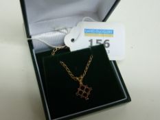 Ruby lattice pendant on chain hallmarked 9ct