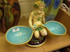 Victorian Mintons Majolica centrepiece in the form of a Bacchanal cherub supporting two panniers,