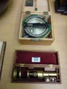 Tank Compass, boxed and an early 20th Century portable brass microscope in mahogany case