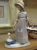 Lladro figure of a girl with a pull along toy