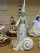 Lladro figure of a princess and a Nao snail figure