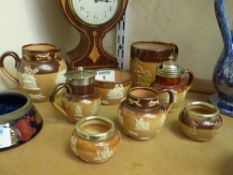 Collection of Edwardian Royal Doulton stoneware jugs, mug and condiment pieces (eight)