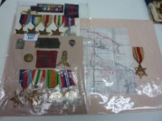 Two groups of WWII Campaign Medals with associated badges, North Africa Star with associated map