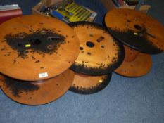 Three decorated plywood spool coffee tables