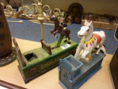 Two novelty cast iron money boxes 'Show Jumper' and 'Trick Pony'