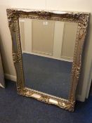 Rectangular bevelled edge wall mirror in traditional swept silvered frame