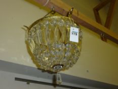 Dome shaped light fitting with cut crystal pendants and three matching wall lights