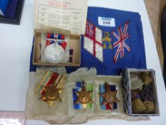 Group of four WWII Campaign Medals, collection of buttons, badges and an embroidered panel