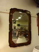 Early 20th Century octagonal bevel edged wall mirror in carved oak frame