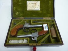 Pair mid 19th Century percussion cap pocket pistols, turn off steel barrels with walnut stocks