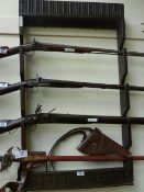 Antique carved oak wall mounted gun rack