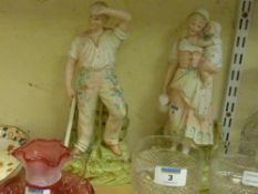 Pair of early 20th Century continental figures of country folk 32cm