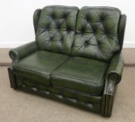 Traditional two seat settee and matching armchair in green leather