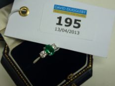 Three stone emerald and diamond 18ct white gold ring hallmarked