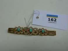 Vintage gate bracelet with turquoise and seed pearl bow links stamped 15ct