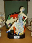 Figurine 'Tea with Clarice Cliff' by Kevin Francis and a Clarice Cliff book