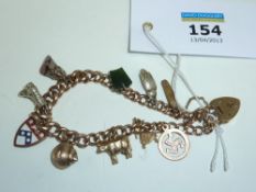 Rose gold chain link bracelet hallmarked 9ct with charms