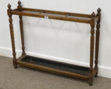 Edwardian oak and mahogany stick stand with brass dividers, 94cm