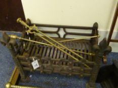 Cast iron dog grate, brass poker and pair of tongs