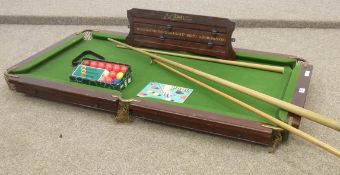 Small slate bed table top snooker table with balls, cues and score board, 72 x 133cm overall