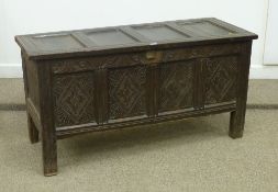 17th century oak coffer, four panel top, original carved frieze above later carved panel front 136cm