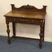 Edwardian oak side table with frieze drawer and carved decoration