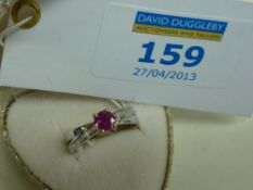 Ruby and diamond baguette crossover ring stamped 750